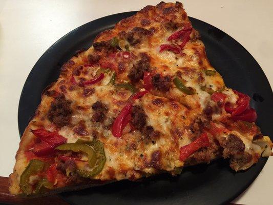 Sausage and pepper slice of pizza at Tony's- think deep dish style- good stuff!