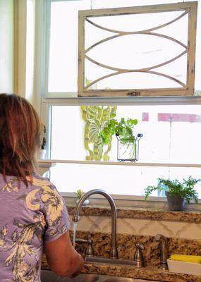 My mother using her newly updated kitchen area with our french nest find!