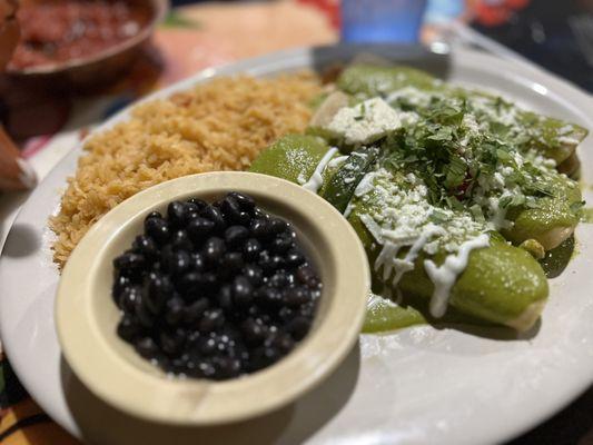 Enchiladas Poblanas Three Enchiladas stuffed with grilled chicken and spinach, topped with our roasted poblano salsa