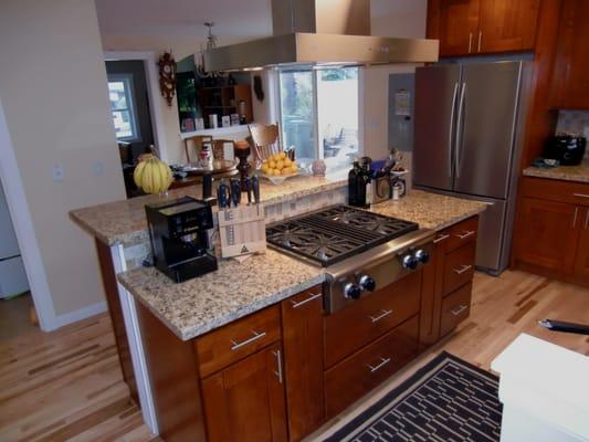 Remodeled kitchen- island with commercial gas range top