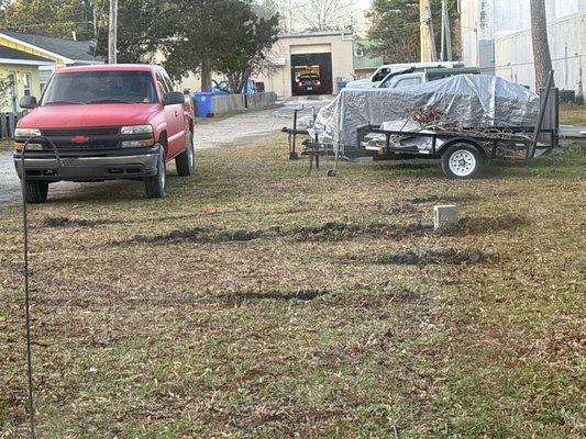 The yard torn up DEEP by the truck tires. Who in their right mind would think a yard is a turnaround ???????