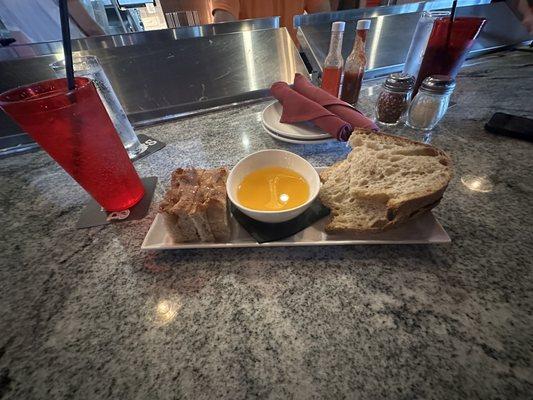 Bread and oil appetizer.