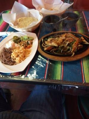 Chicken fajitas with refried beans and flour tortillas