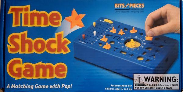 "Time Shock Game". It is similar to "Perfection", the pieces pop-up at the end, and you race against the clock to win!!