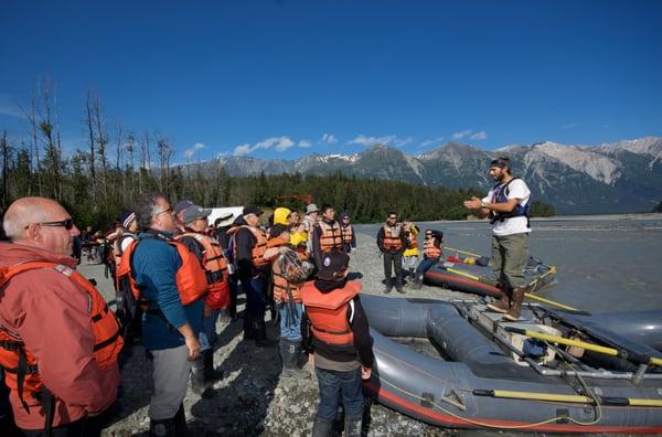 Guides give a safety briefing before loading up into the Rafts on the Tsirku