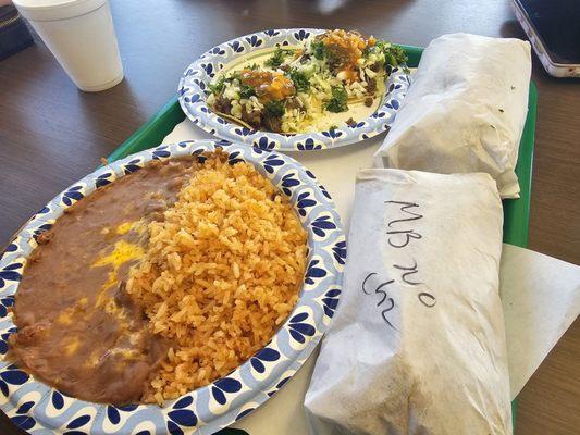 Rice and beans, chili Verde burrito, carne asada burrito and tacos.