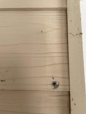 Hole drilled into siding