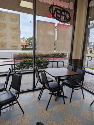 You can enjoy your donut and newspaper. A few tables in the dining.