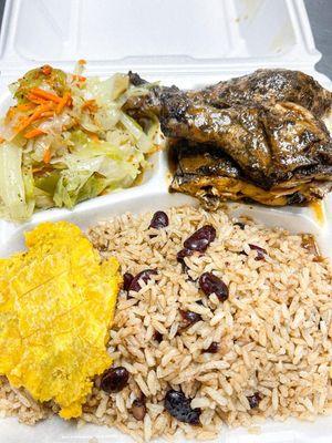 Jerk Chicken with Haitian rice, steamed cabbage and fried plantains