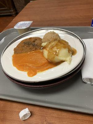 Great  steak for dinner tonight with mashed potatoes with bread rolls on top.