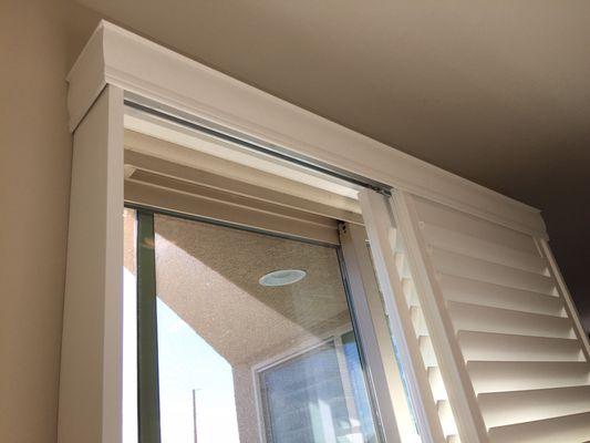 Bypass track shutters on a sliding glass door