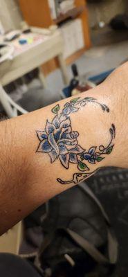 Blue flower tattoo