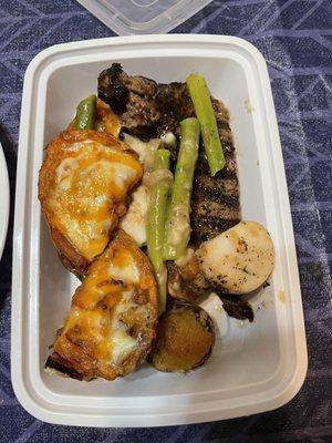 NY Steak, Potato Skins, stuffed Mushrooms, scallops (Surf & Turf), and Asparagus.