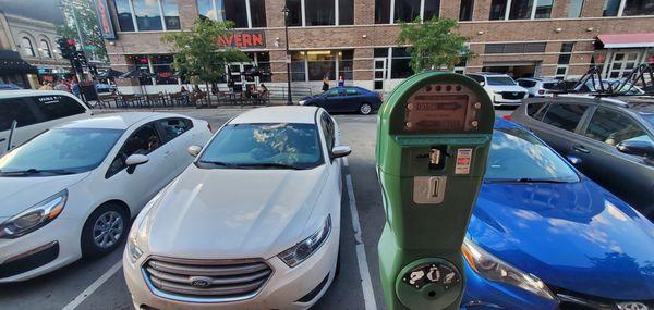 my white car next to the blue, ticket was for the meter with the other white car