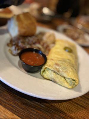 Omelet with peppers, onions, jalapeños... hash browns. Delicious!