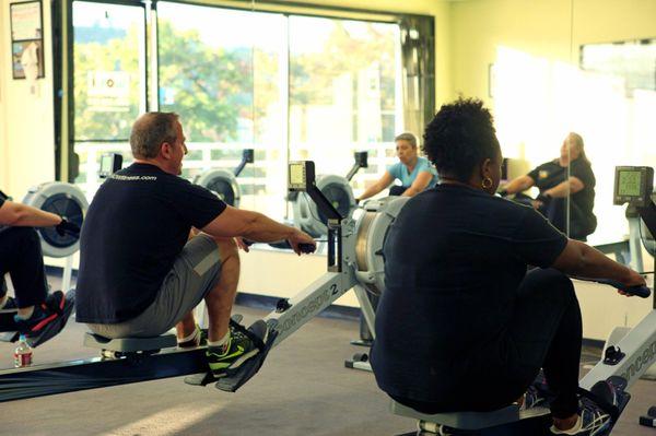 A group of rowers completing a workout in our studio