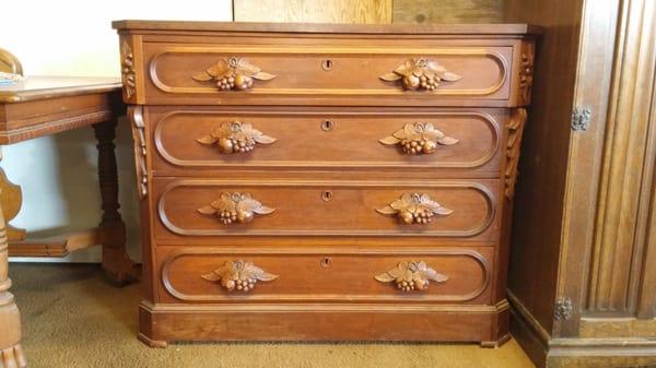 Beautiful detail on this antique mahogany dresser.