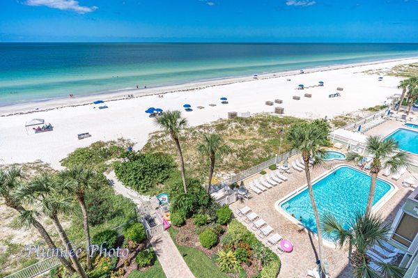 View of pool deck and Gulf of Mexico beach from Sand Castle I beach condo on Indian Shores, Florida.