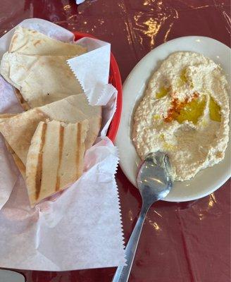 Hummus and pita appetizer.