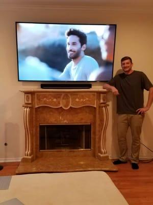 I look small next to this 75" 4K Samsung tv. Sonos soundbar below