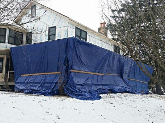 Northern Ohio exterior work requires tarp and heaters.