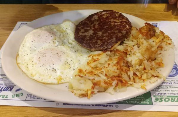 2 eggs over easy, sausage patty, crispy hashbrowns.