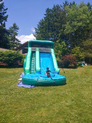 14 ft water slide in our back yard