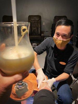 Khoi giving an amazing pedicure while I enjoy my cocktail