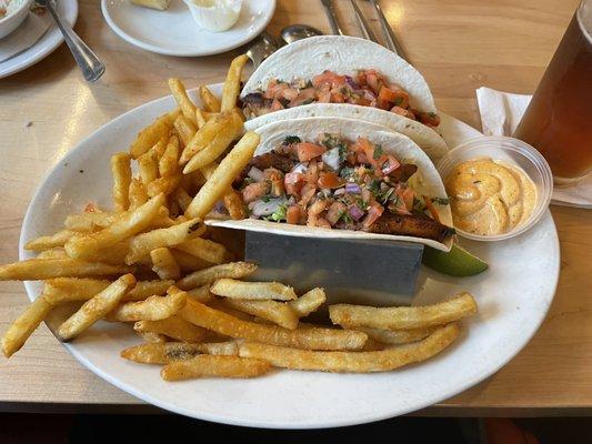 Blackened Fish Tacos with spicy ranch and crispy fries.