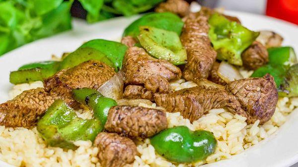 Steak tips over rice