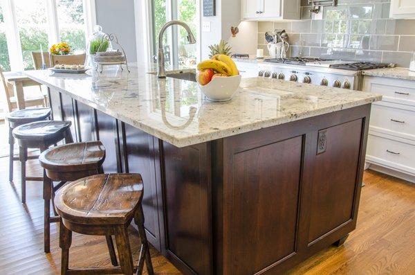 Kitchen remodel with a farmhouse style sink and contrasting island