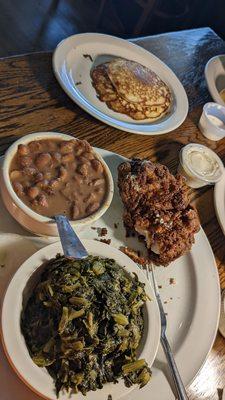 Pork 'tenderloin' actually a chop, fried to hell in OLD oil as told to us by the waitress, pinto beans, turnip greens, fried cornbread