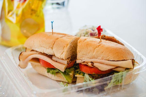 Boxed lunches- sandwich, chips, water, potato salad, cookie