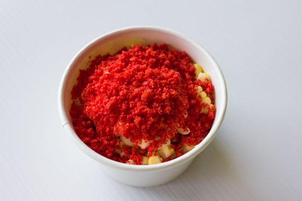 Hot Cheeto Elote served in a cup