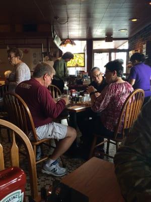 "Tiffany" style stained glass adorns the walls and windows at this charming local breakfast nook.