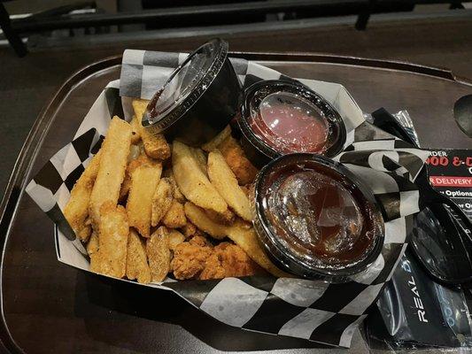 Chicken fingers and fries with extra barbecue sauce, delicious!