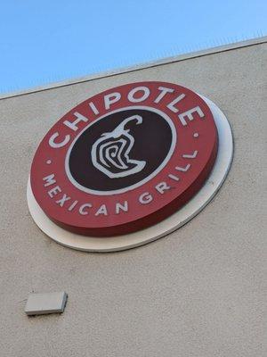 Chipotle logo on the side of the building