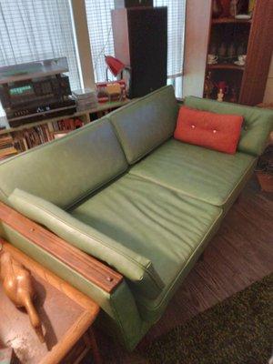 MCM Ranch Oak loveseat reupholstered in moss green, easy care vinyl. Beautiful.