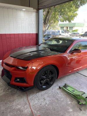 5th gen Camaro changed to 6th gen front end and painted. Carbon fiber hood, roof painted black, side view mirrors as well as other goodies!