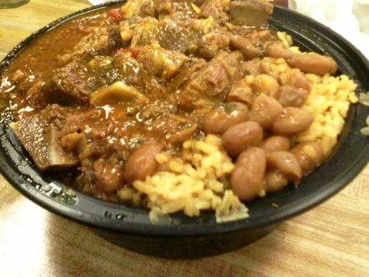 Stew Goat with yellow rice and beans