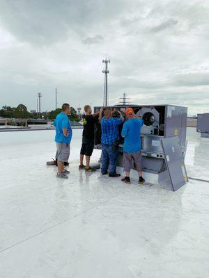 Air Woodlands Guys Installing a 12.5 ton rooftop unit.