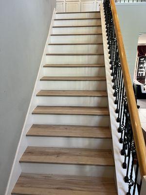 Cortona Maxx vinyl plank steps with white risers.