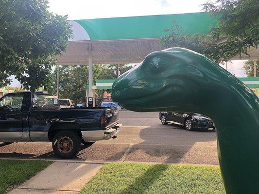 The gas station car wash with a dinosaur!