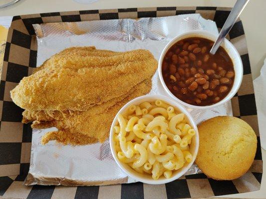 Catfish, barbecue baked beans, mac and cheese, and a cornbread muffin.