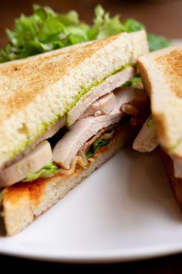 Turkey Club - House-roasted turkey, bacon, roasted tomatoes, lettuce & herb aioli on white toast