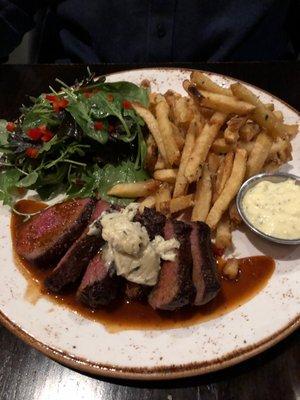 Steak frites accompanied with spinach