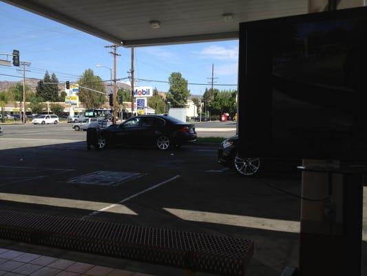 Getting my car washed. $9.99 hand wash is a good deal.