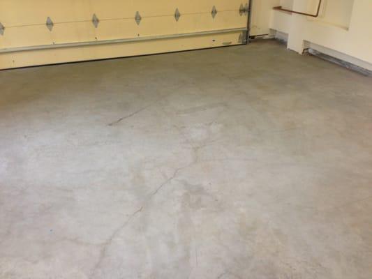 Large cracks forming in the garage floor of a brand new home, before even taking possession.