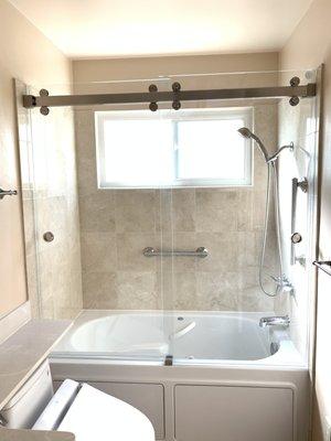 Starphire Double Slider Over Tub. Double Bi-Pass. Barndoor Style Slider. Brushed Stainless Steel Square Style Hardware.