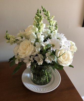 Arrangement sitting on a large dinner plate.